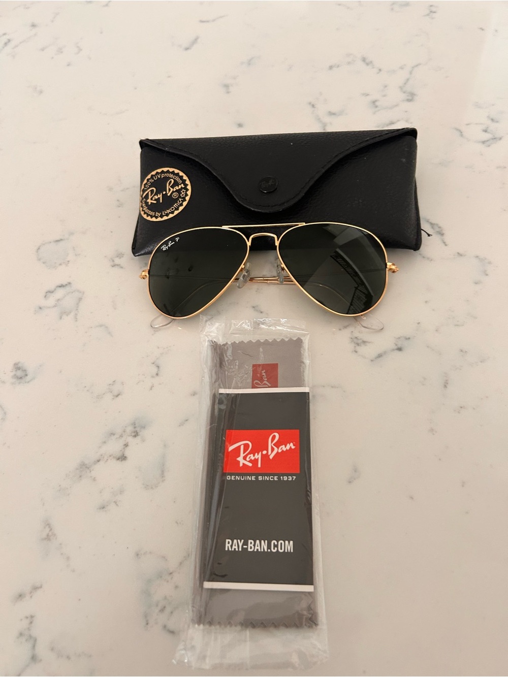Ray-Ban women’s Gold Aviator Sunglasses with Green Lenses
